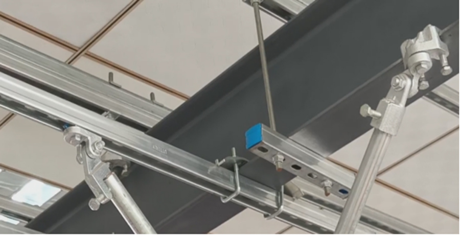 On-site seismic bracing system installation with strut U clip bracket on steel beam